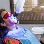 A patient undergoing laser treatment for gum issues
