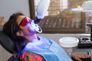 A patient undergoing laser treatment for gum issues